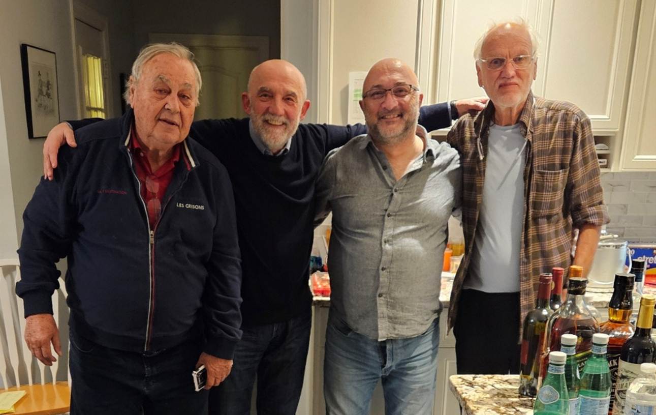 A group of men standing in a kitchen

AI-generated content may be incorrect.