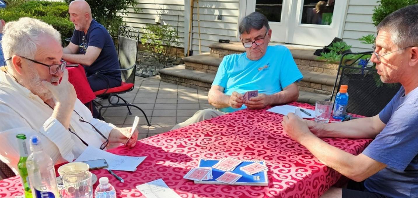 A group of people sitting around a table

Description automatically generated